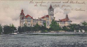 1908 Postcard.Old Main with bluebonnets